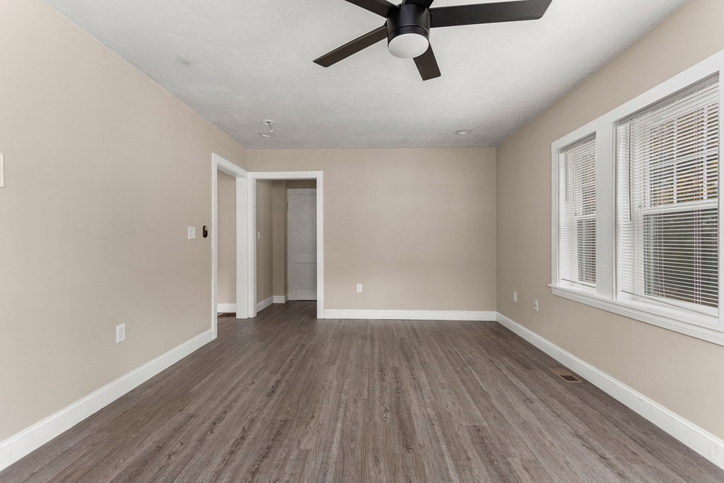 195 Eastern Avenue Worcester, MA 01605 - Photo 9 of 24 wooden floor in an empty room with a window