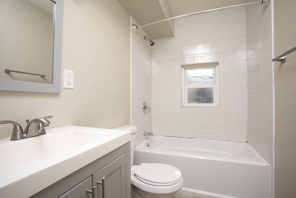 195 Eastern Avenue Worcester, MA 01605 - Photo 10 of 24 a bathroom with a sink a toilet and shower
