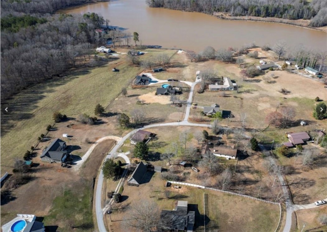 123 Bass Drive Fair Play, SC 29643 - Photo 26 of 26 This elevated view showcases a serene lakeside community with ample outdoor space.