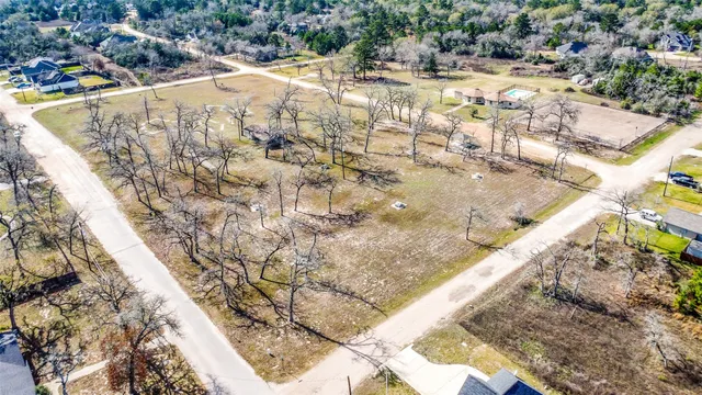 a swimming pool with some trees in the background
