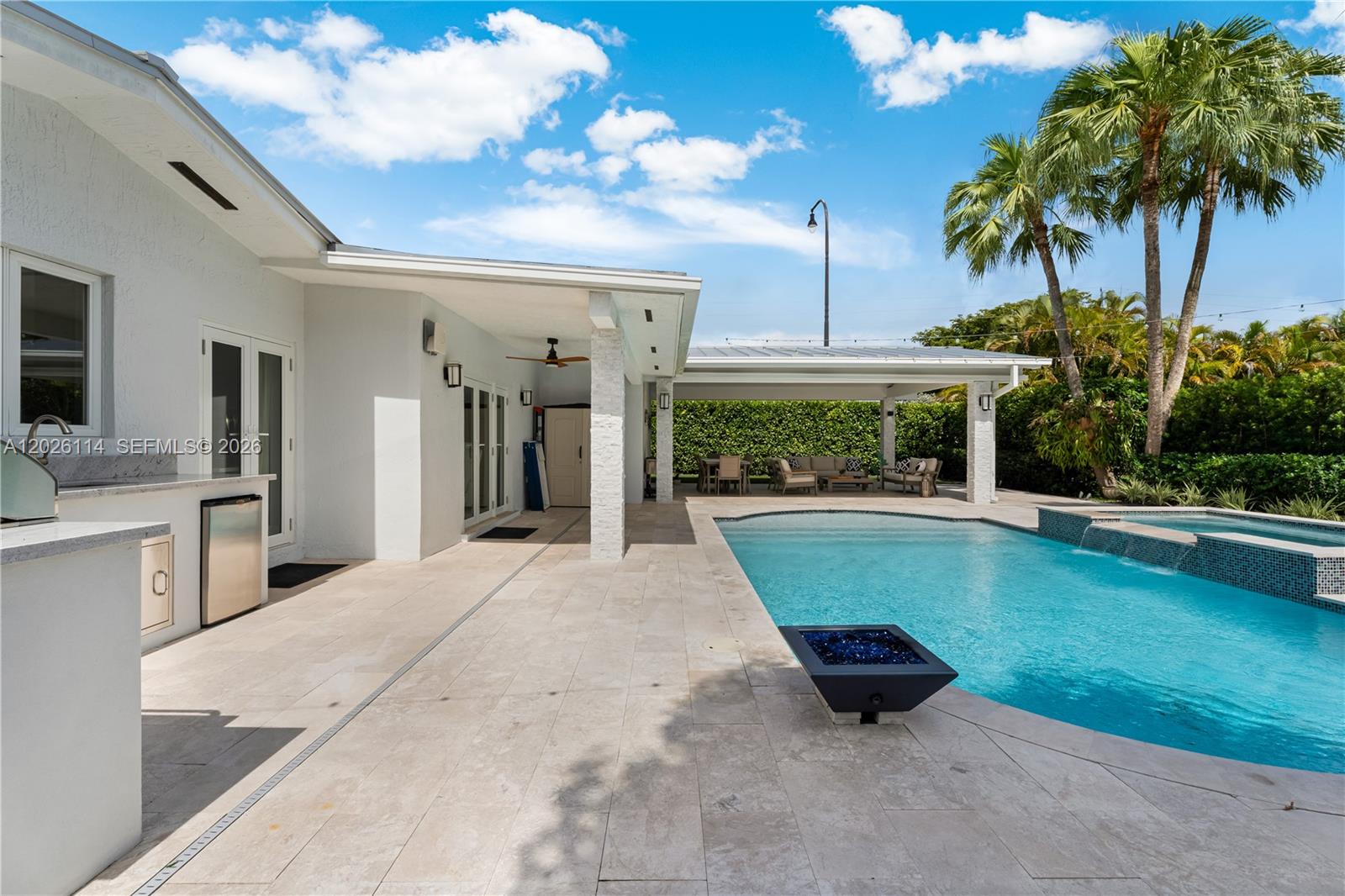 9641 Southwest 66th Street Miami, FL 33173 - Photo 49 of 57 a swimming pool with outdoor seating and yard