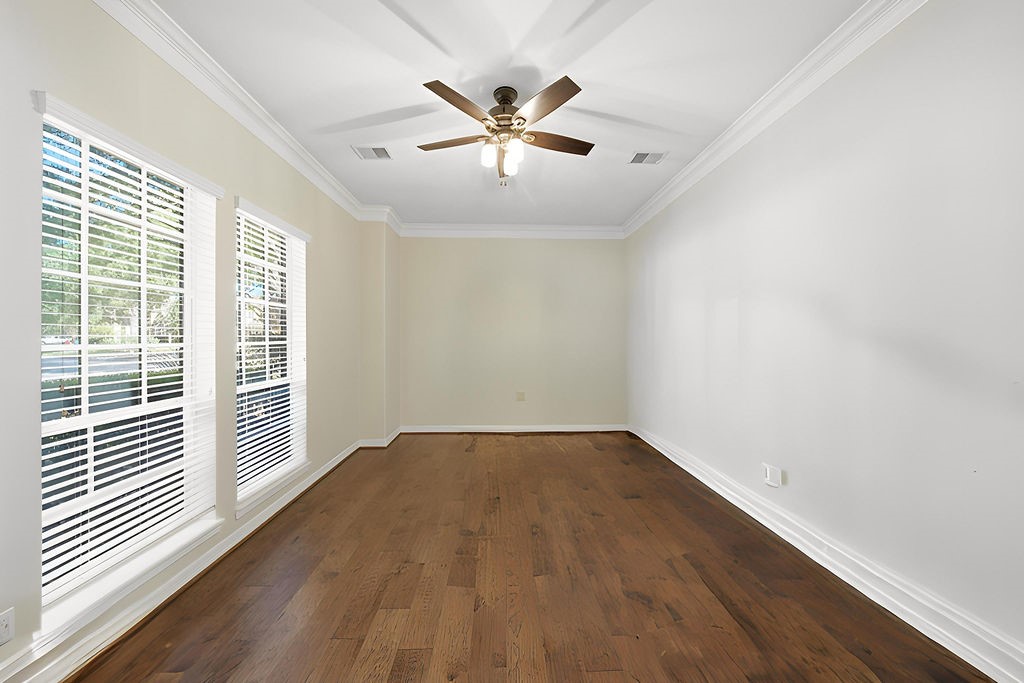 5811 Desert Oak Way Spring, TX 77379 - Photo 12 of 43 wooden floor in an empty room with a window