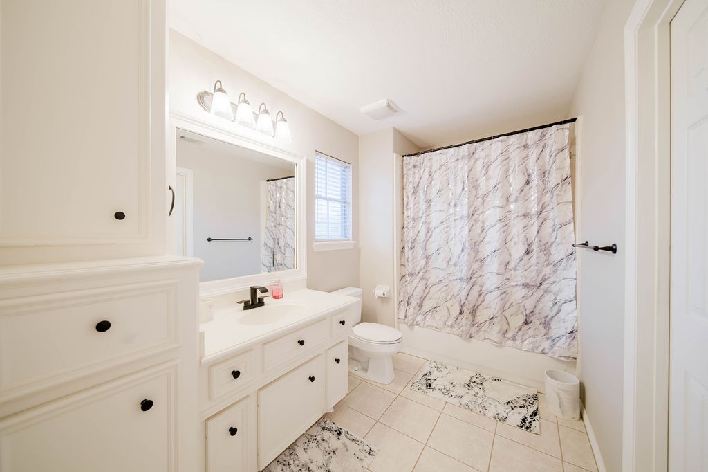 5811 Desert Oak Way Spring, TX 77379 - Photo 35 of 43 a bathroom with a sink vanity mirror and shower