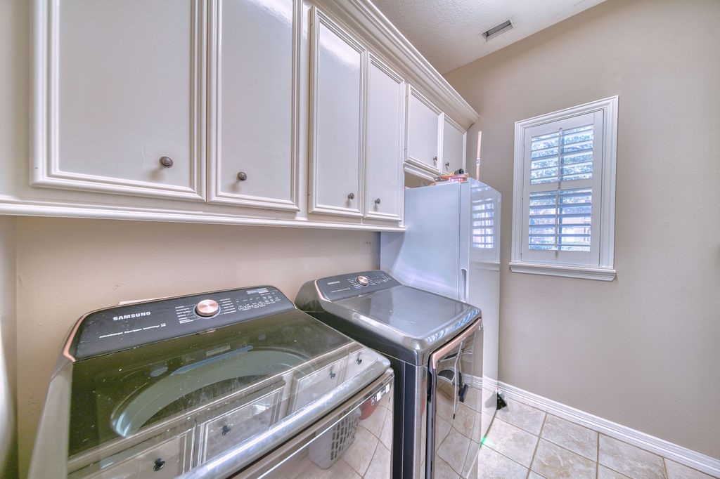 5811 Desert Oak Way Spring, TX 77379 - Photo 39 of 43 a utility room with sink dryer and washer