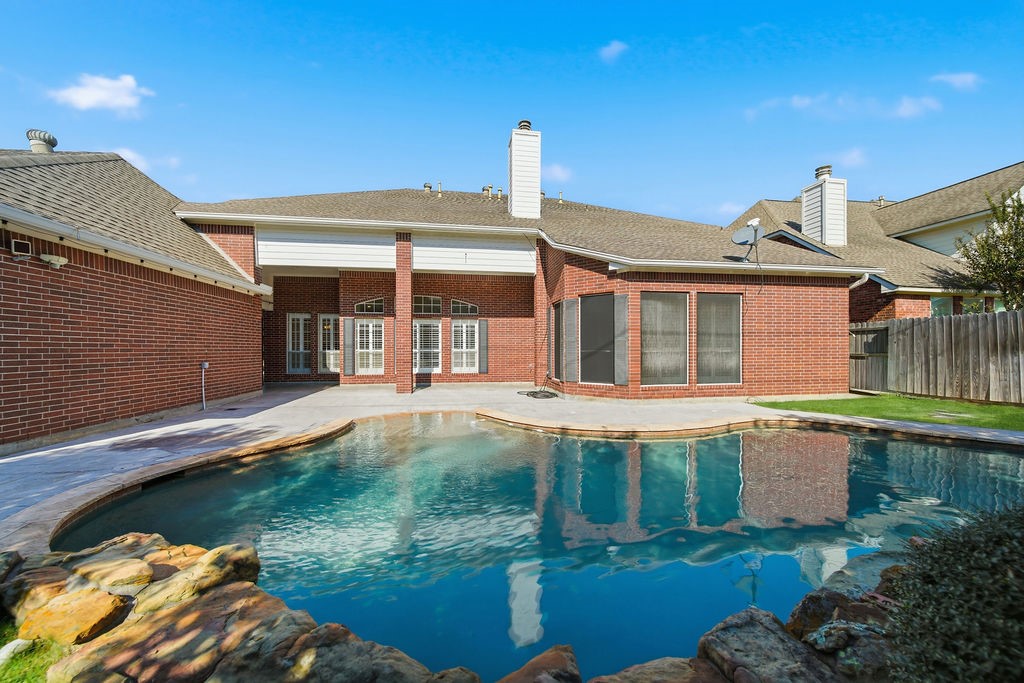 5811 Desert Oak Way Spring, TX 77379 - Photo 6 of 43 a front view of a house with garden