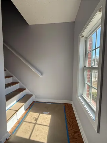 a view of an empty room and a window