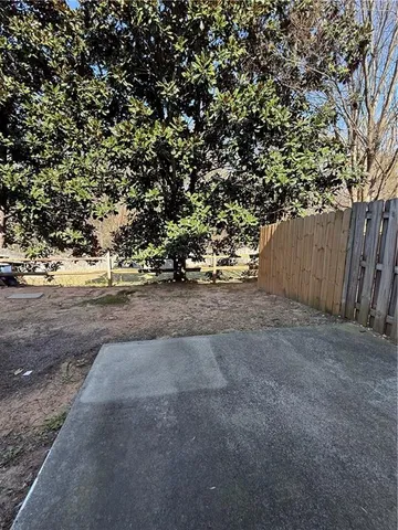 a view of a yard with an tree