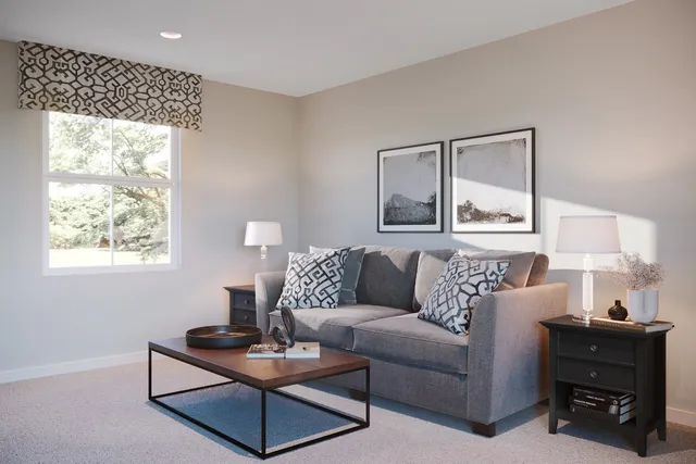 a living room with furniture and a lamp