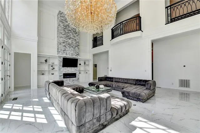 a view of hallway with stairs and wooden floor