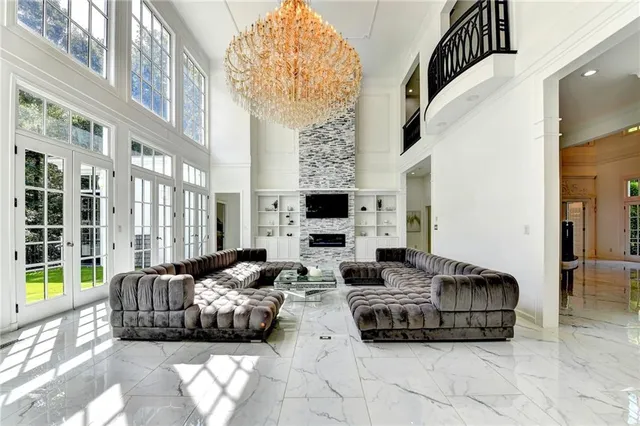 a spacious bedroom with a bed and wooden floor