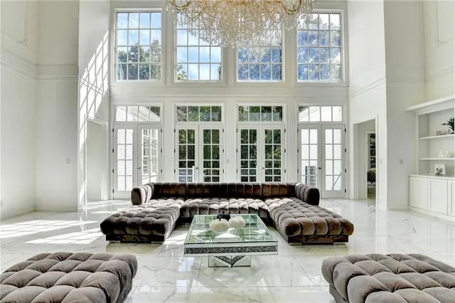 a spacious bedroom with a bed and a cabinets