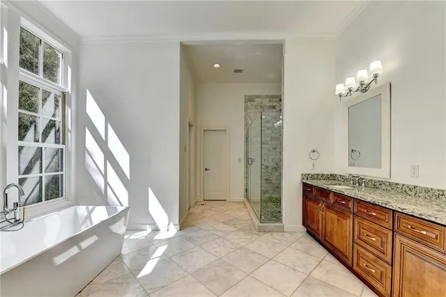 a large room with lots of furniture and a chandelier