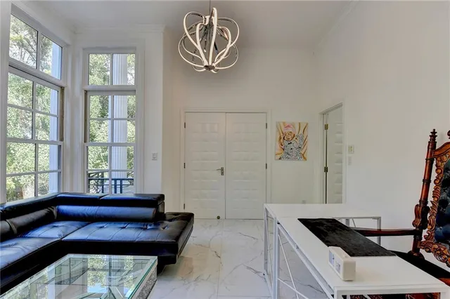 a room with furniture and flat screen tv