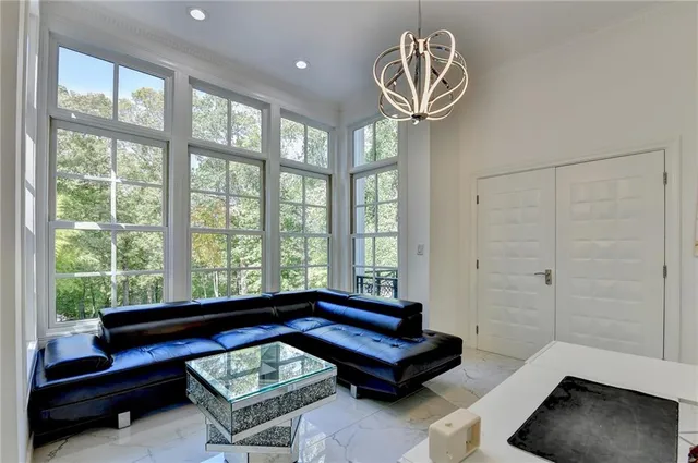 a spacious bedroom with a bed and a window