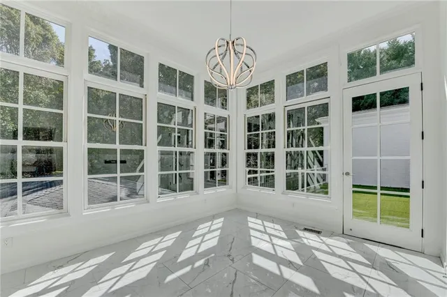 front view of a house with a yard and a garage