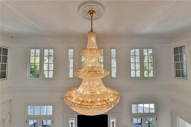 an aerial view of residential house with outdoor space and trees all around