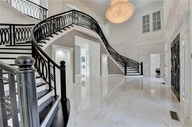 a view of entryway with wooden floor and stairs