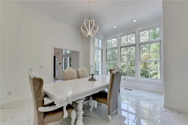 a kitchen with stainless steel appliances granite countertop a stove refrigerator and cabinets