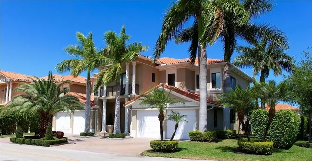 front view of house with a palm plants