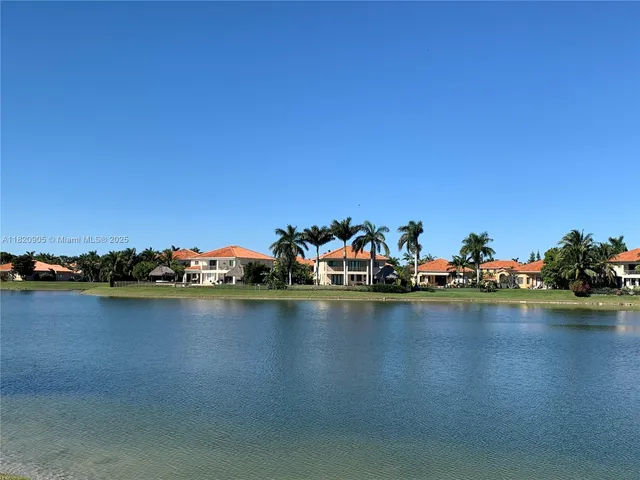 a view of a room with lots of trees and houses