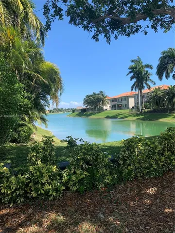 a view of a lake with houses in outdoor space