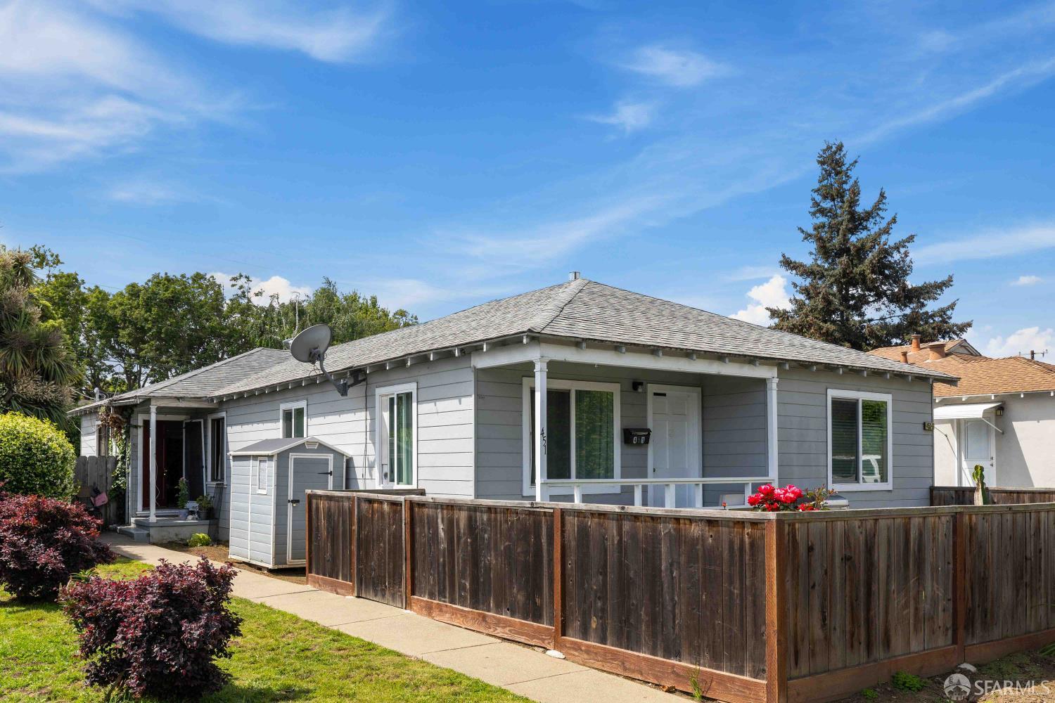 a view of a house with a yard and a garden
