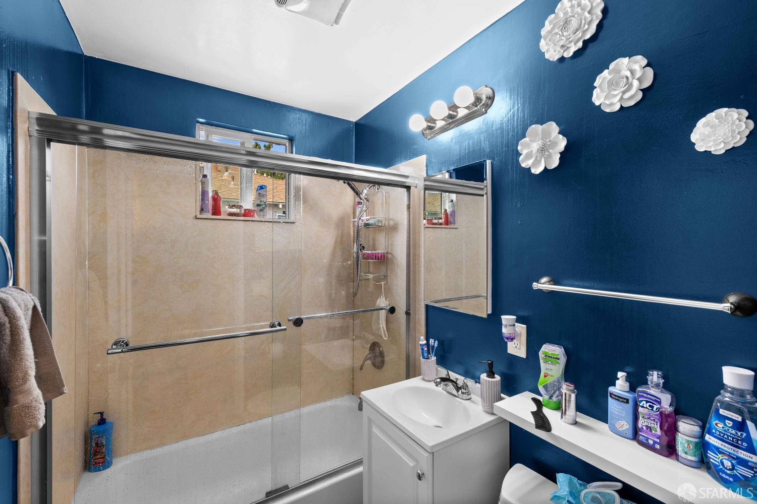 451 Rollins Road Burlingame, CA 94010 - Photo 13 of 23 a bathroom with a sink mirror vanity and toilet