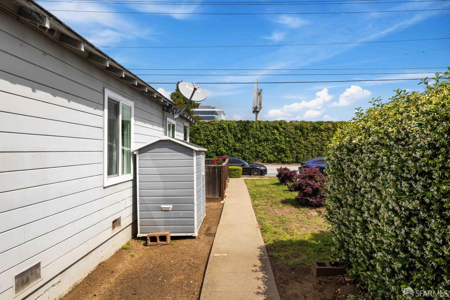 451 Rollins Road Burlingame, CA 94010 - Photo 21 of 23 a pathway of a house with a yard
