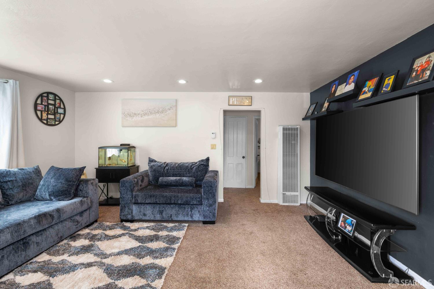 451 Rollins Road Burlingame, CA 94010 - Photo 5 of 23 a living room with furniture and a flat screen tv
