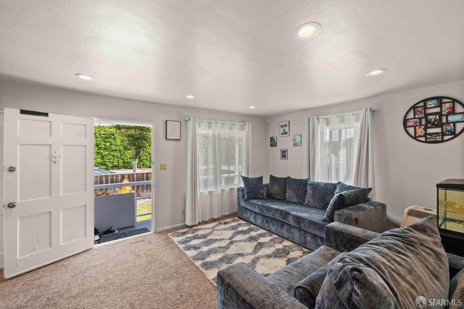 451 Rollins Road Burlingame, CA 94010 - Photo 6 of 23 a living room with furniture and a window