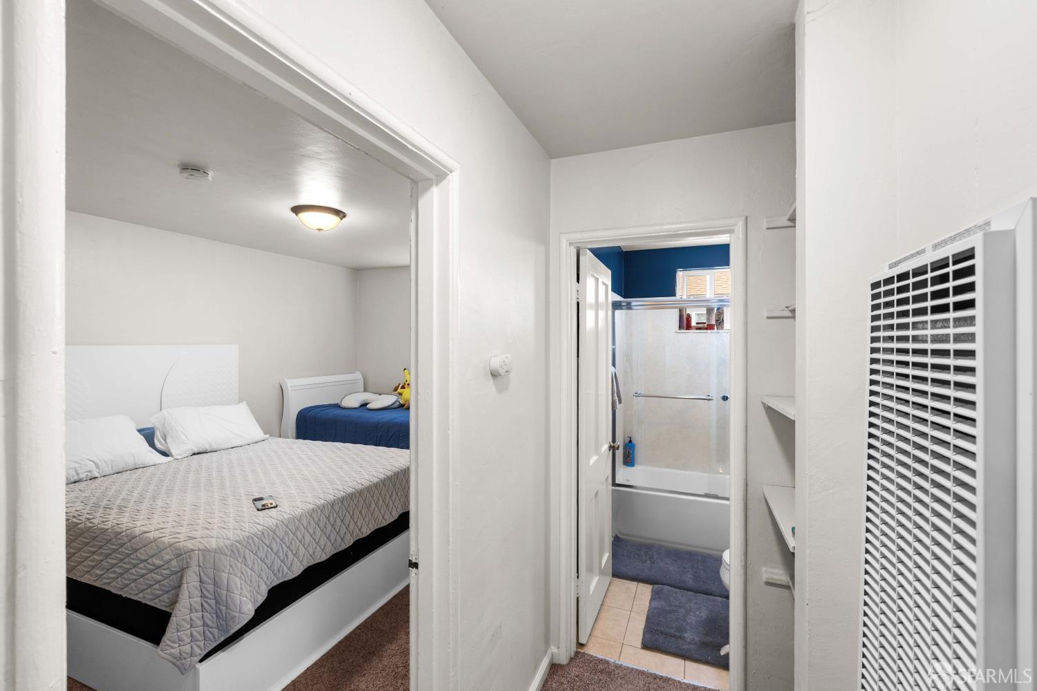 451 Rollins Road Burlingame, CA 94010 - Photo 10 of 23 a bedroom with a bed and a lamp