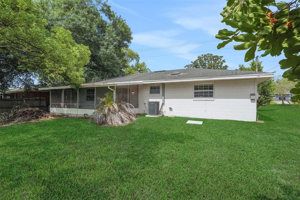 404 Lake Ned Road Winter Haven, FL 33884 - Photo 17 of 18 a front view of house with yard and green space