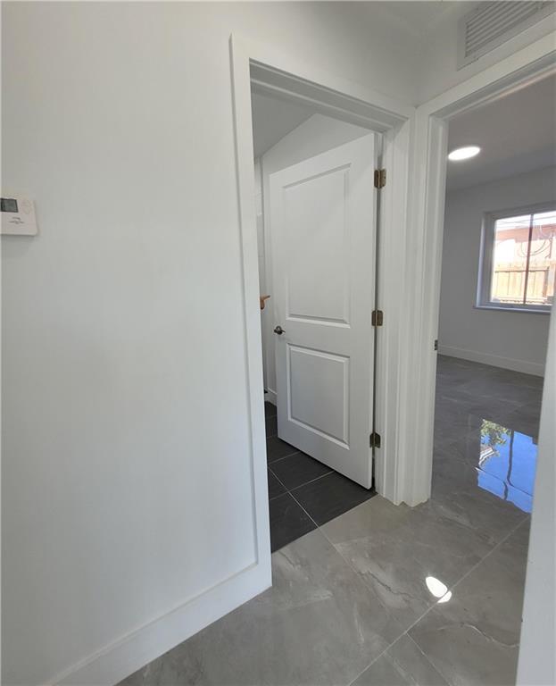 6041 Southwest 17th Street Miami, FL 33155 - Photo 13 of 26 a view of a hallway with wooden floor and closet