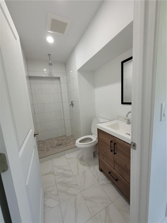 6041 Southwest 17th Street Miami, FL 33155 - Photo 14 of 26 a bathroom with a sink a toilet and shower