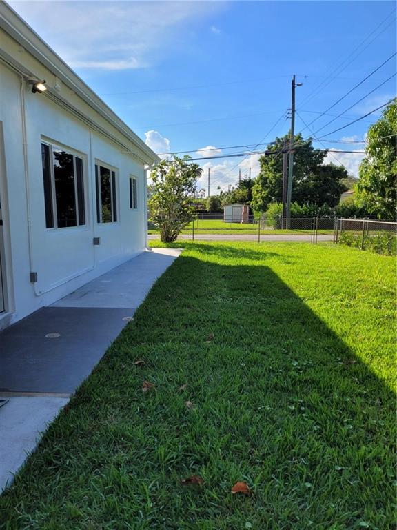 6041 Southwest 17th Street Miami, FL 33155 - Photo 22 of 26 a house view with a garden space