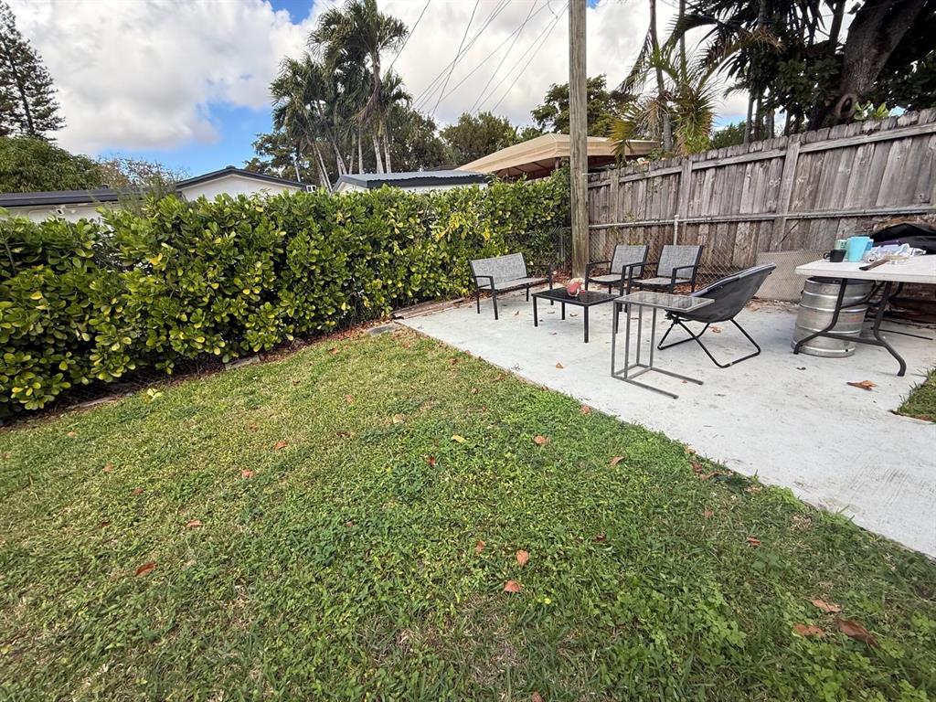 6041 Southwest 17th Street Miami, FL 33155 - Photo 25 of 26 a view of backyard with seating and green space