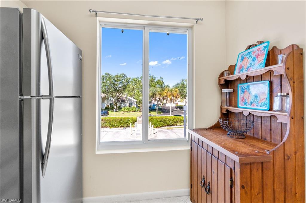 2155 San Marco Road, Unit 2204 Marco Island, FL 34145 - Photo 11 of 22 a view of kitchen with furniture and refrigerator