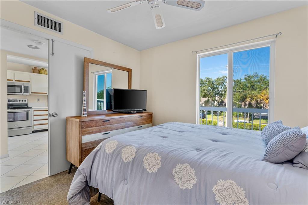 2155 San Marco Road, Unit 2204 Marco Island, FL 34145 - Photo 13 of 22 a bedroom with a bed and a television