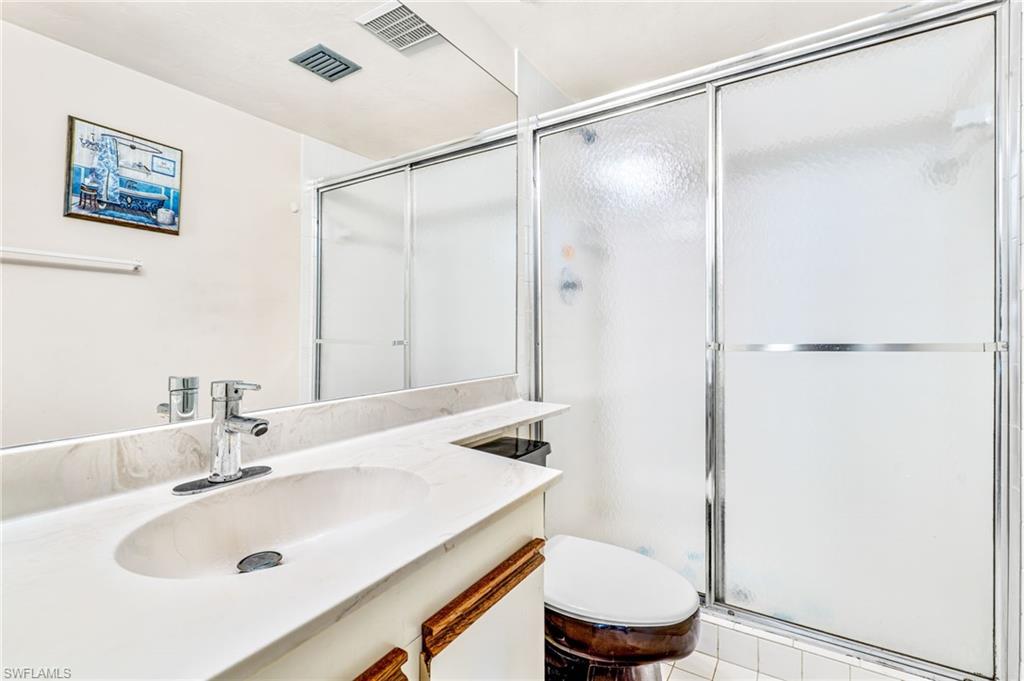 2155 San Marco Road, Unit 2204 Marco Island, FL 34145 - Photo 14 of 22 a bathroom with a sink and a mirror