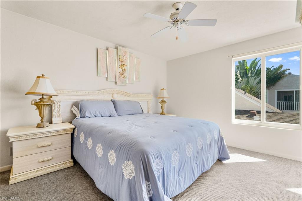 2155 San Marco Road, Unit 2204 Marco Island, FL 34145 - Photo 15 of 22 a bedroom with a bed and large window