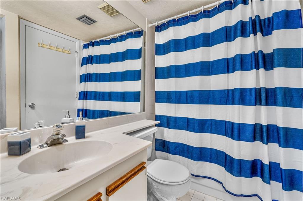 2155 San Marco Road, Unit 2204 Marco Island, FL 34145 - Photo 17 of 22 a bathroom with a sink toilet and shower