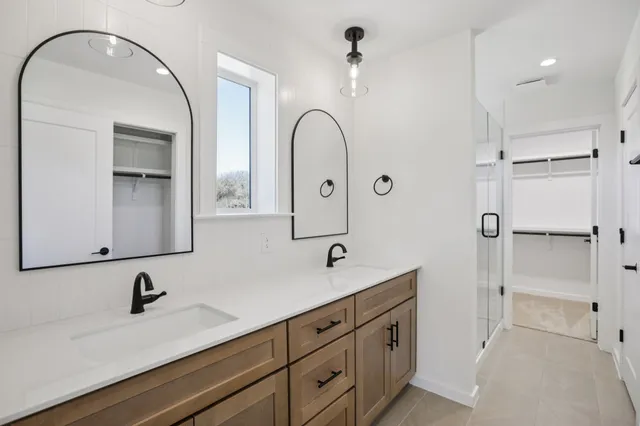 a bathroom with a sink and mirror
