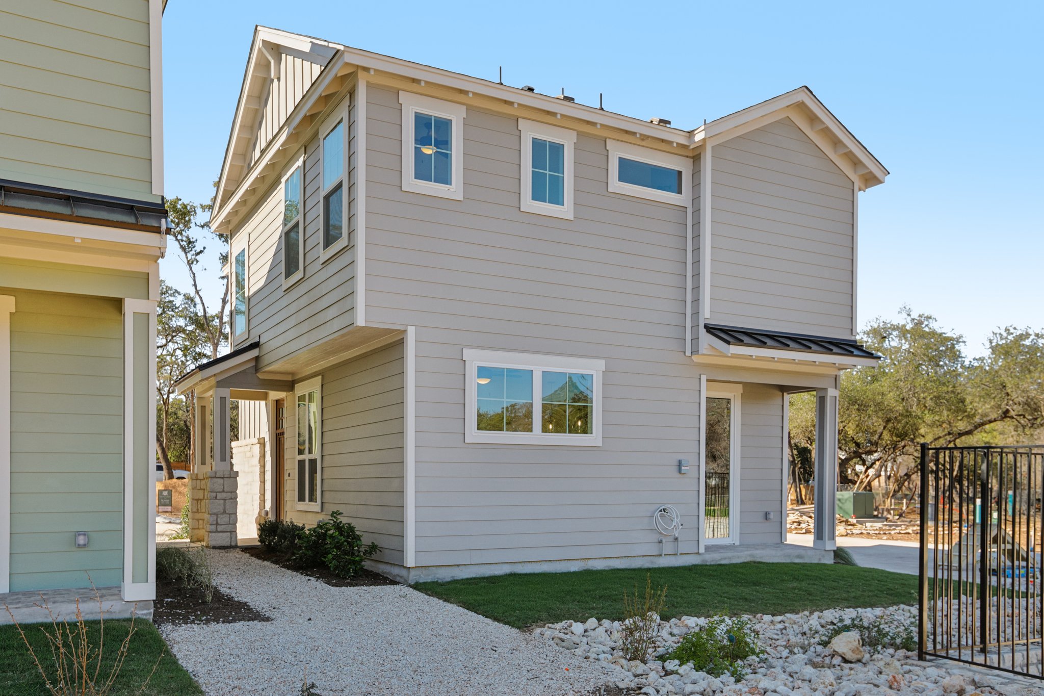2414 Drew Lane, Unit 5 Austin, TX 78748 - Photo 23 of 24 Rear view of property with a patio and a metal roof