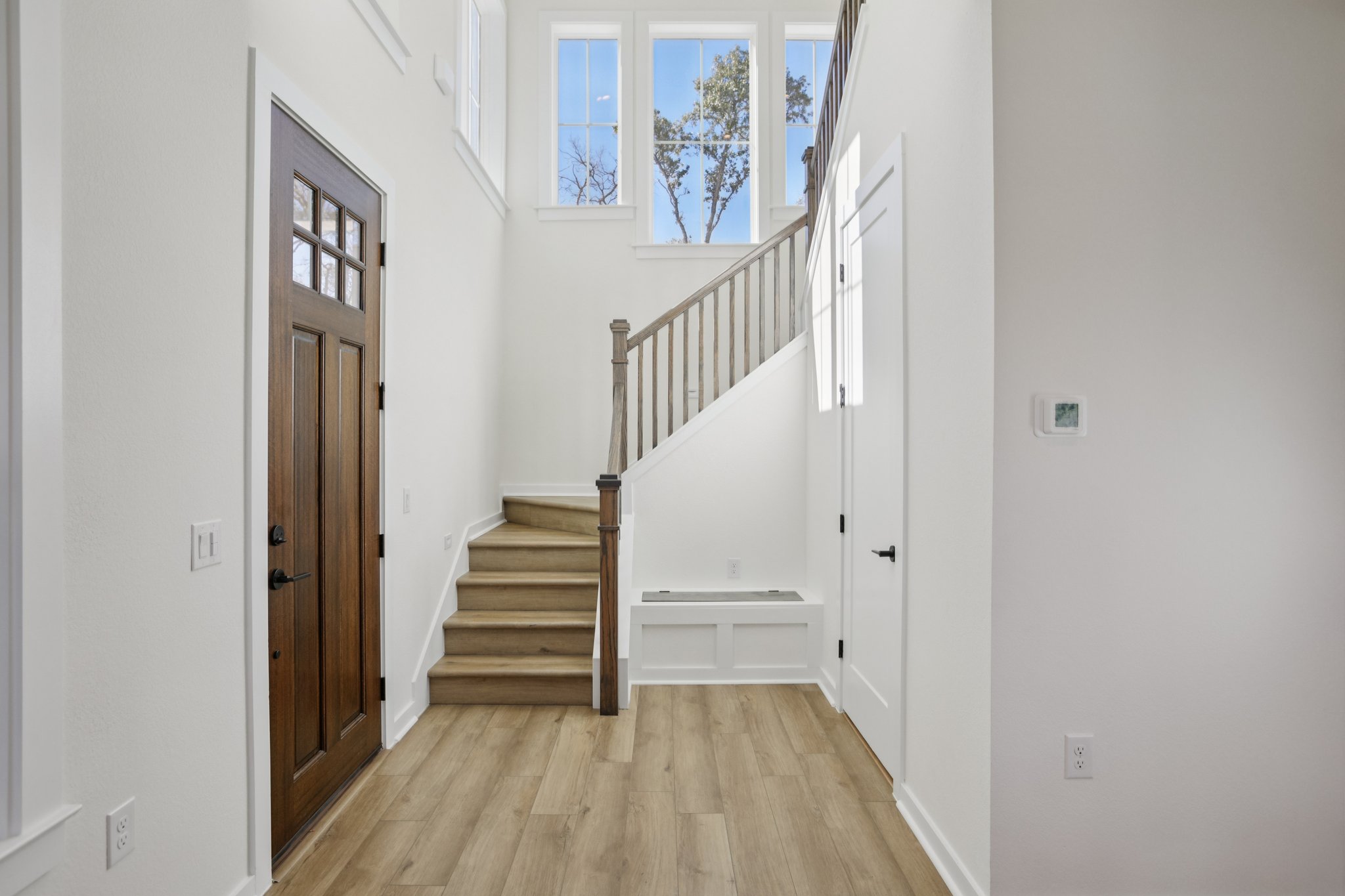 2414 Drew Lane, Unit 5 Austin, TX 78748 - Photo 4 of 24 Foyer featuring stairs, a high ceiling, and light wood-style floors