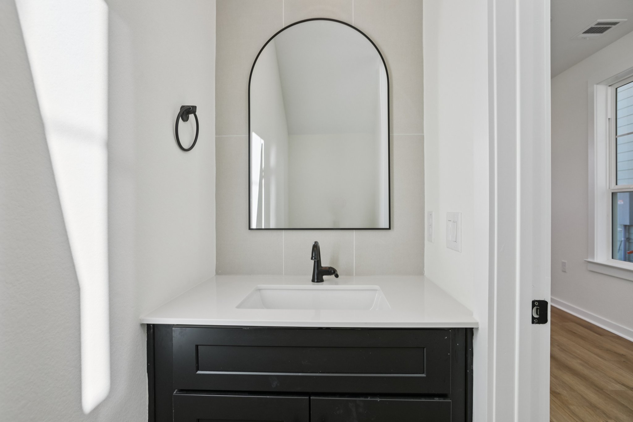 2414 Drew Lane, Unit 5 Austin, TX 78748 - Photo 6 of 24 Bathroom featuring vanity and wood finished floors
