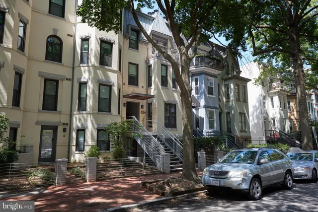 a view of a street with cars