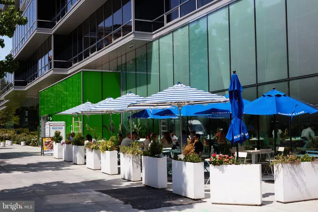 a view of street with retail shops
