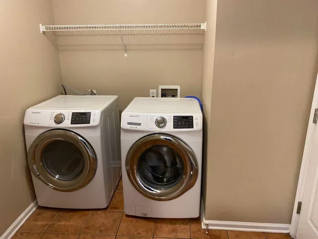 a utility room with dryer and washer