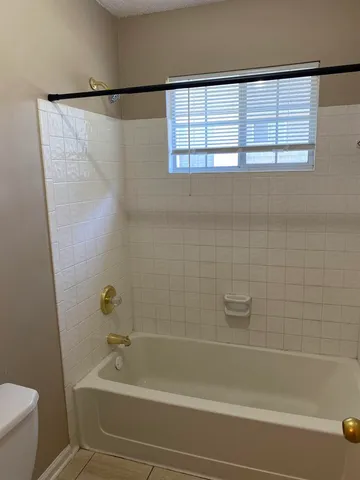 a bathroom with a shower and a bathtub