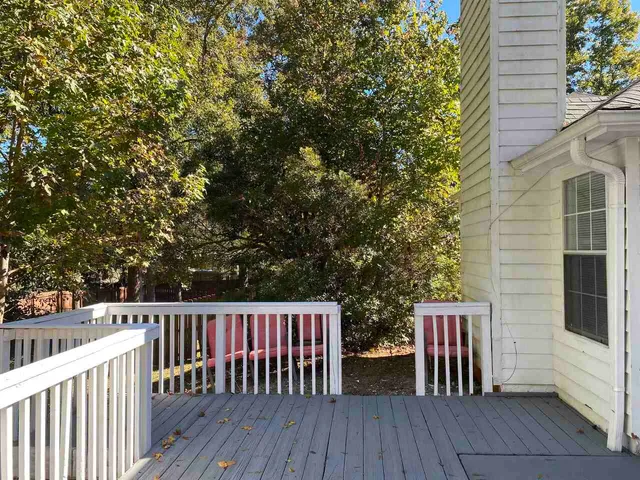 a view of a wooden deck with a bench